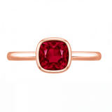 Xylia cushion ruby bezel engagement ring by Tiani Jewellery shown in rose gold, white gold and yellow gold.